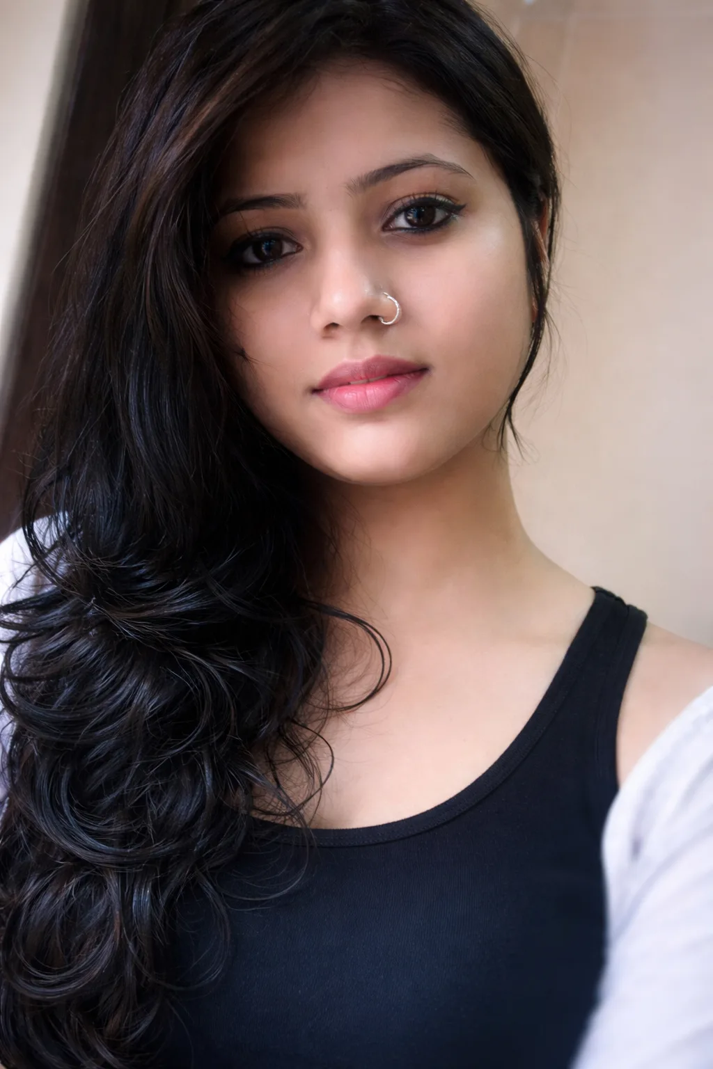 Girl Close-Up Portrait with Long Wavy Hair and Soft Natural Expression